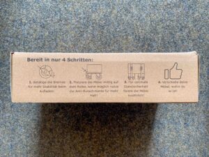 Seitenansicht des Verpackungskartons mit darauf abgedruckter Gebrauchsanweisung.